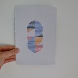 Embroidery on rag paper