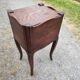 Pair of oak bedside tables with curtained niche doors