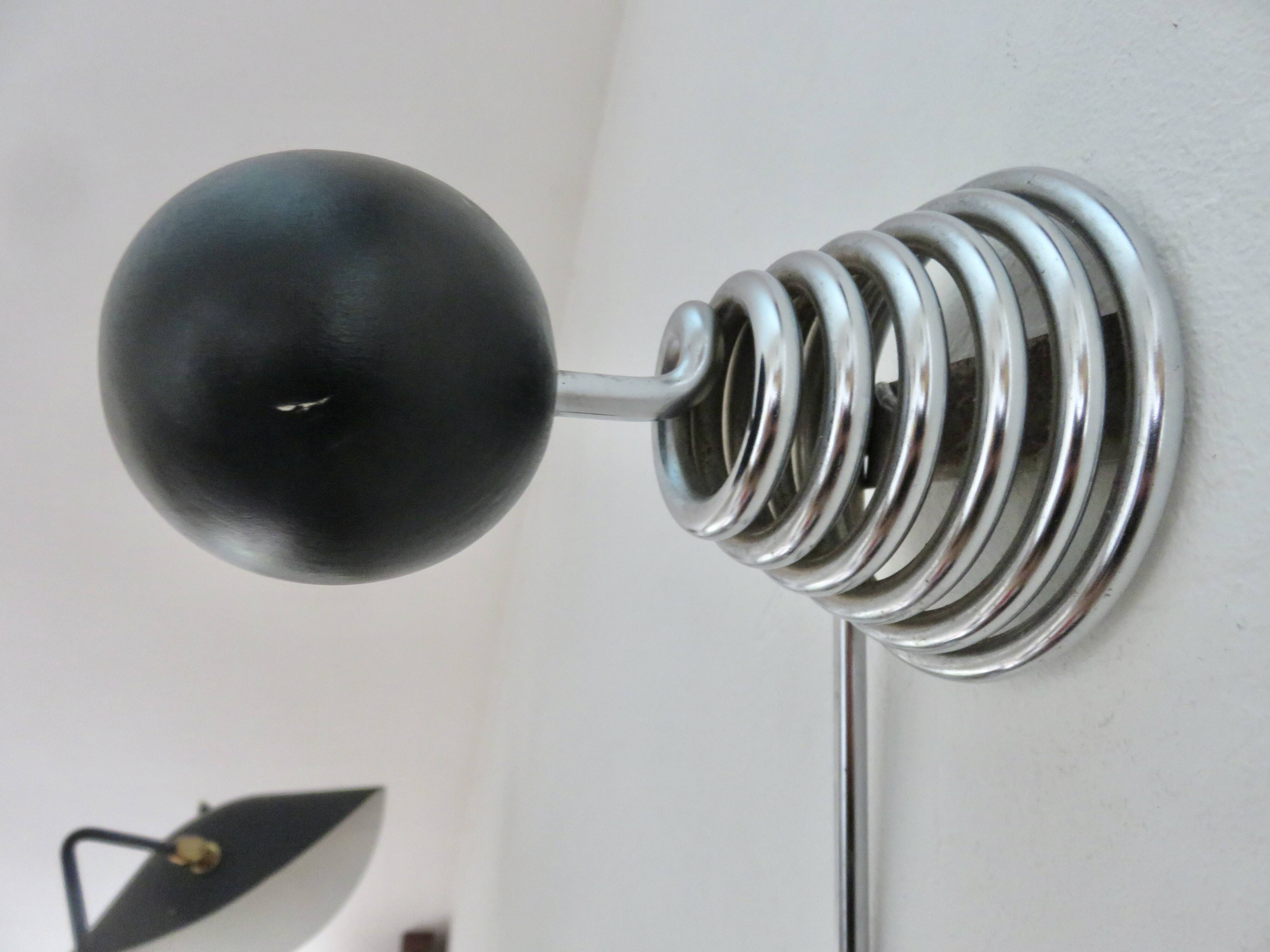 "Streamline" wall coat rack in chromed metal and black lacquered wood, 1970.