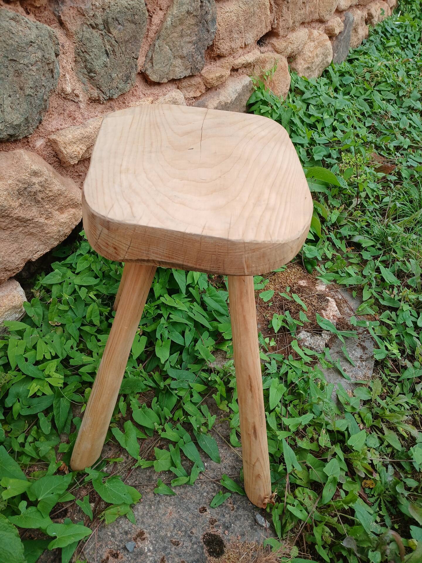 Antique stool in raw wood