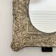 Baroque mirror in repoussé brass