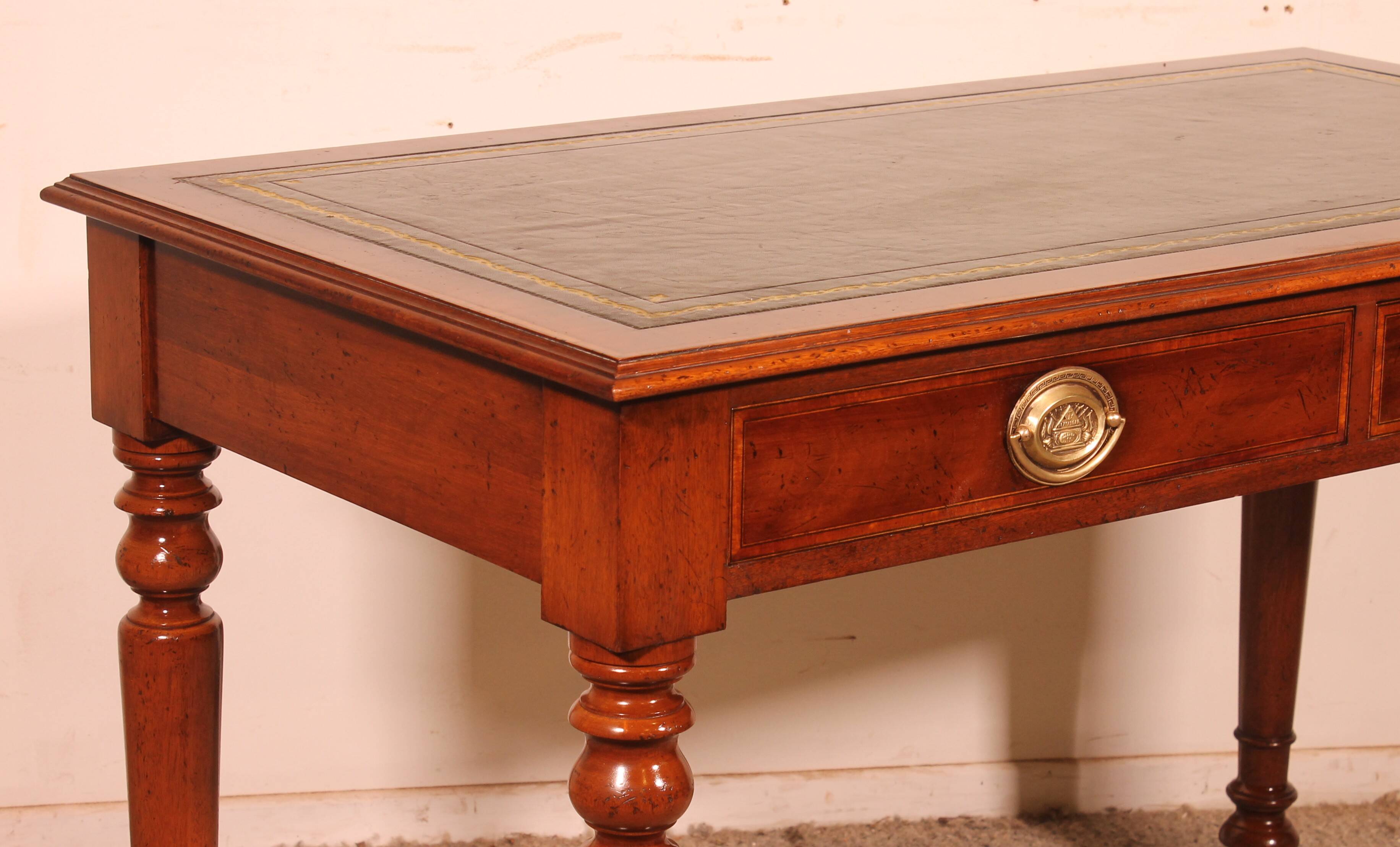 flat desk with two drawers from the 19th century in mahogany and inlays