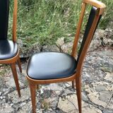 Four vintage beech and skai chairs