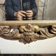 Gold wooden wall mirror with floral decoration