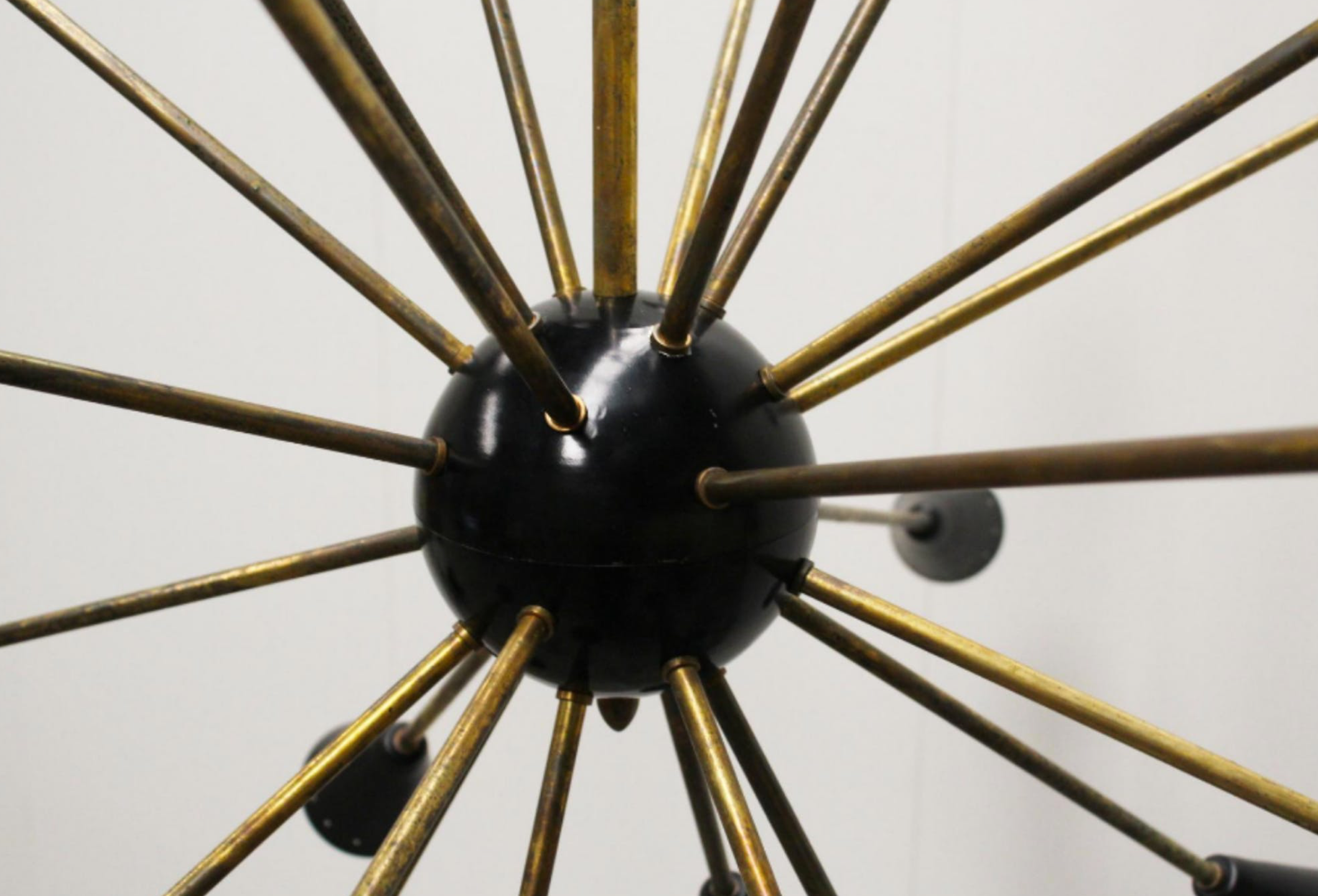 Sputnik 24 arms in black lacquered metal and brass chandelier