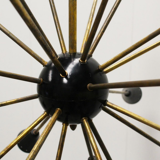 Sputnik 24 arms in black lacquered metal and brass chandelier