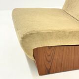 Vintage mid-century beige armchair with wooden frame and ottoman