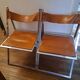 2 Chromed metal and leather folding chairs. 70s. Fontoni & Geraci