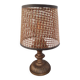 A very original vintage lamp with its cane lampshade