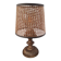A very original vintage lamp with its cane lampshade