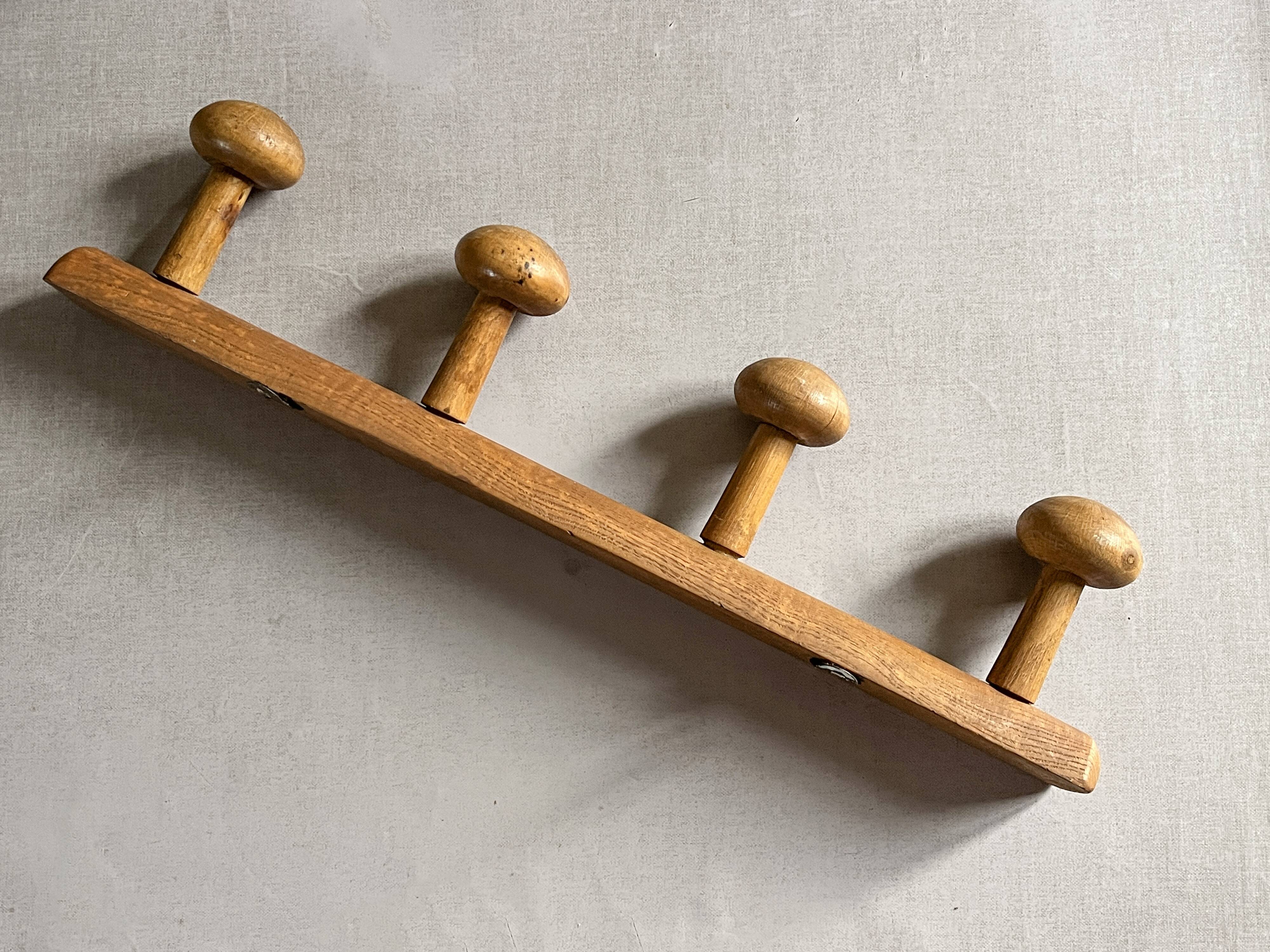 Varnished wooden wall coat rack with 4 hooks, antique item.