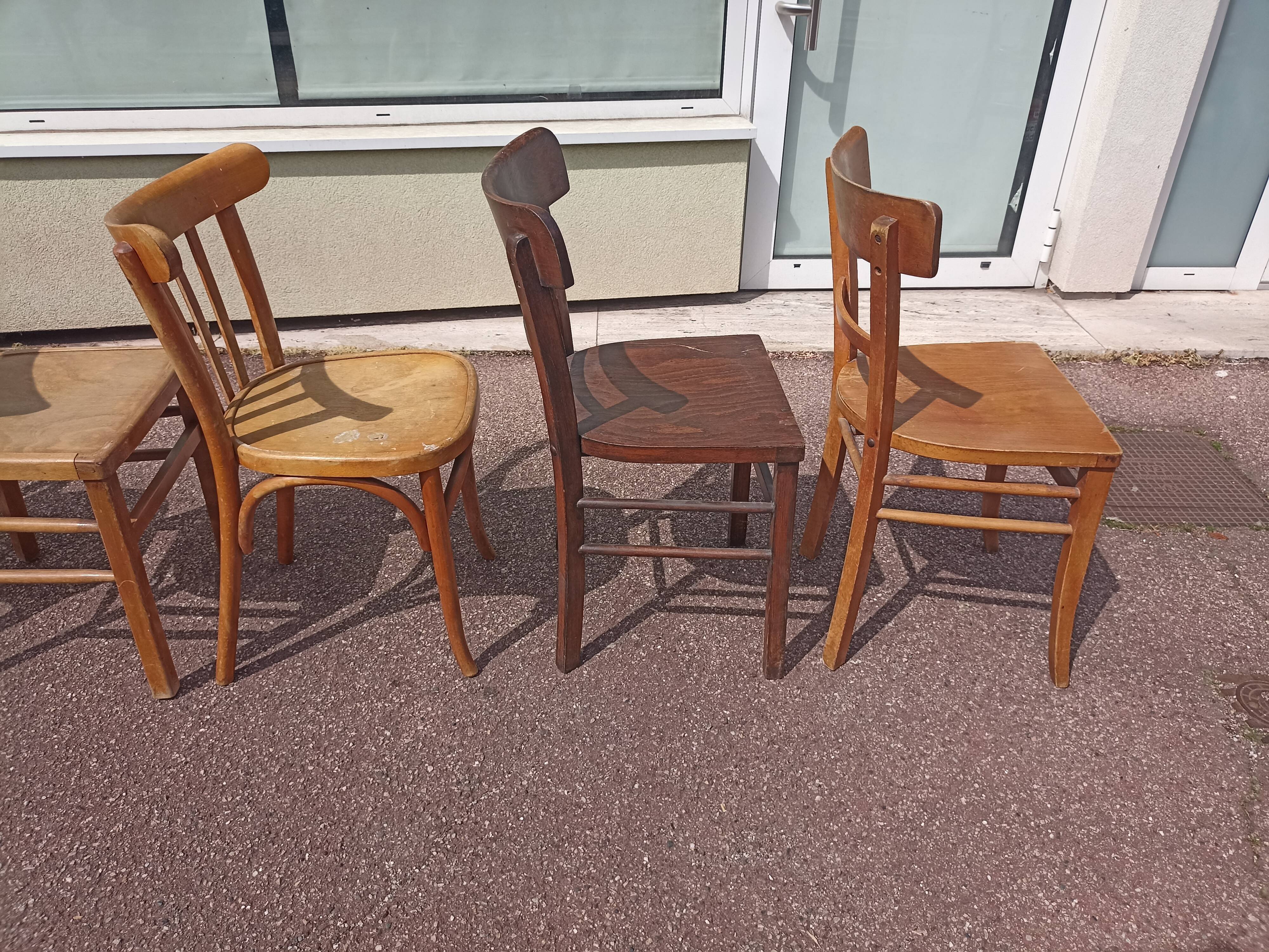 Set of 12 mismatched wooden bistro chairs