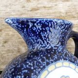 Blue ceramic vase with floral motifs