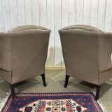 Pair of high-backed Chesterfield armchairs with 1 leather footrest
