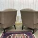Pair of high-backed Chesterfield armchairs with 1 leather footrest