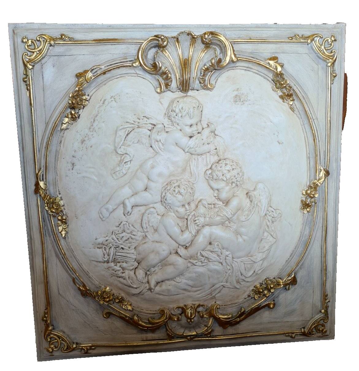 wall panel with angels in stucco and weathered wood