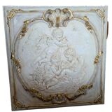 wall panel with angels in stucco and weathered wood