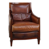 Comfortable Art Deco design armchair in cognac-colored sheepskin combined with wood