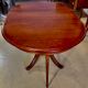 Round or oval table with four chairs in solid cherry, with extensions
