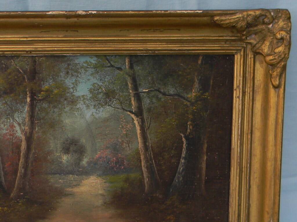 Old signed landscape painting under wood.