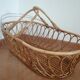 Rattan cradle with its support