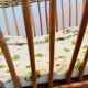 Vintage rattan doll cradle