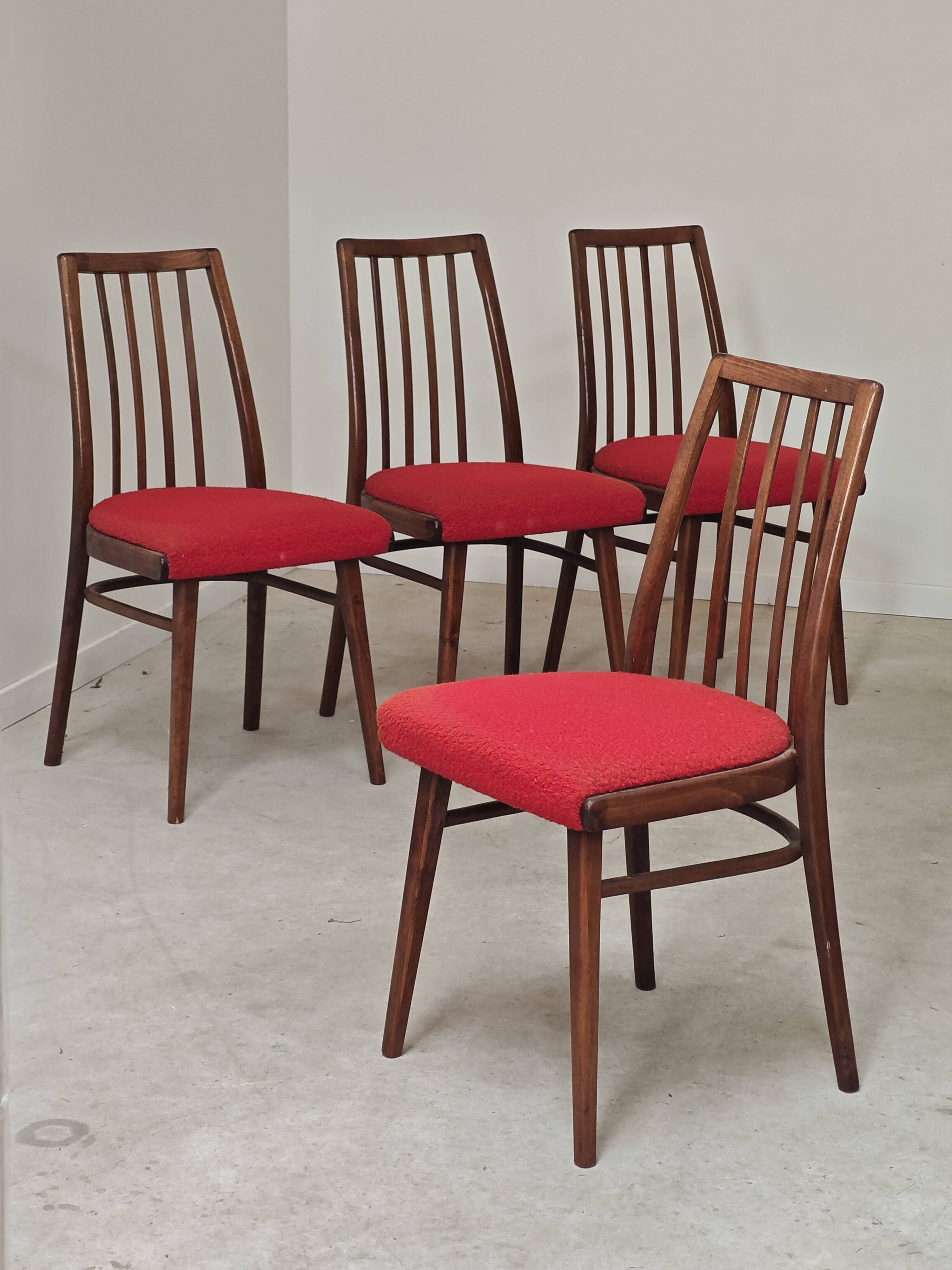 Set of 4 red dining chairs by Antonin Suman for Interier Praha.