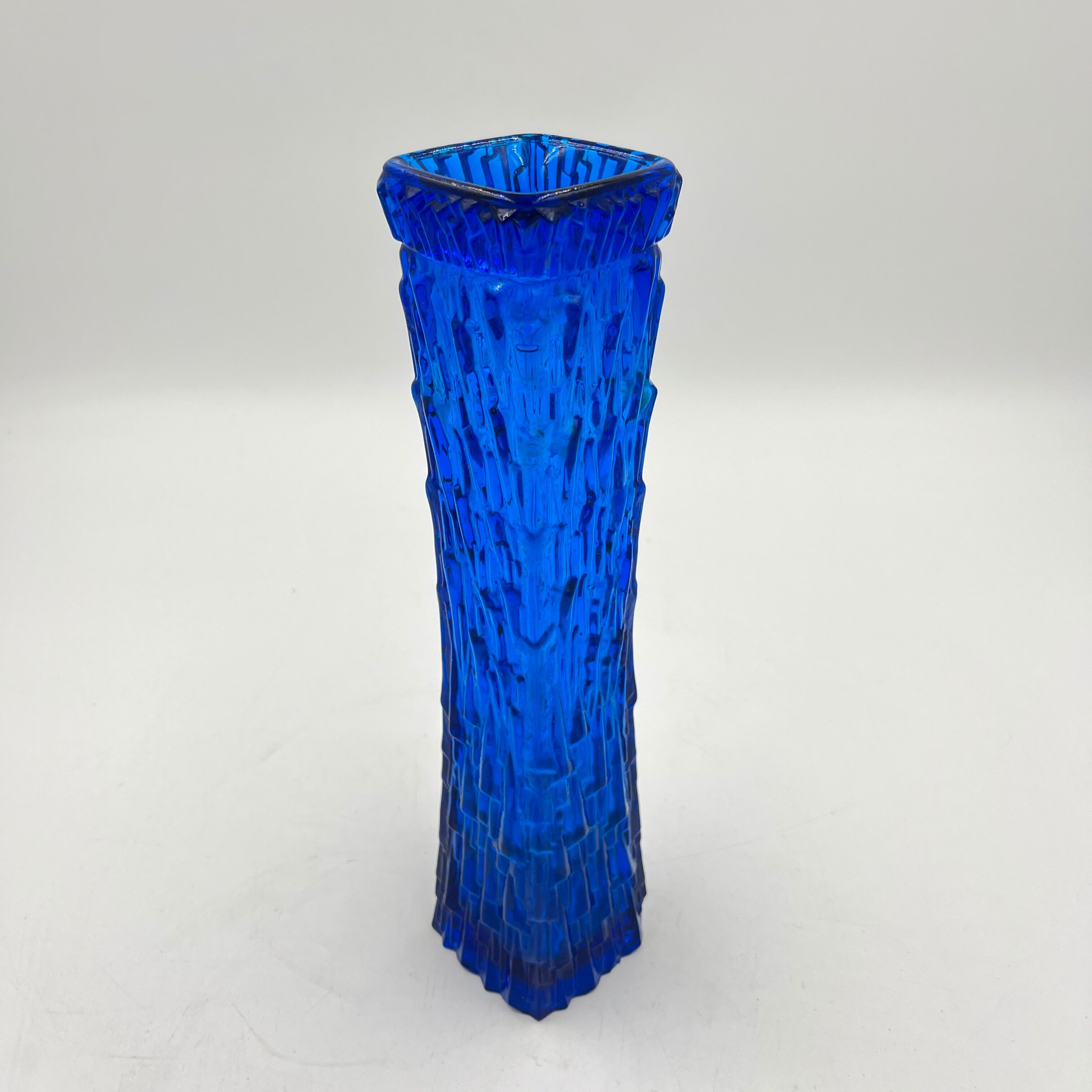 Blue glass vase with relief