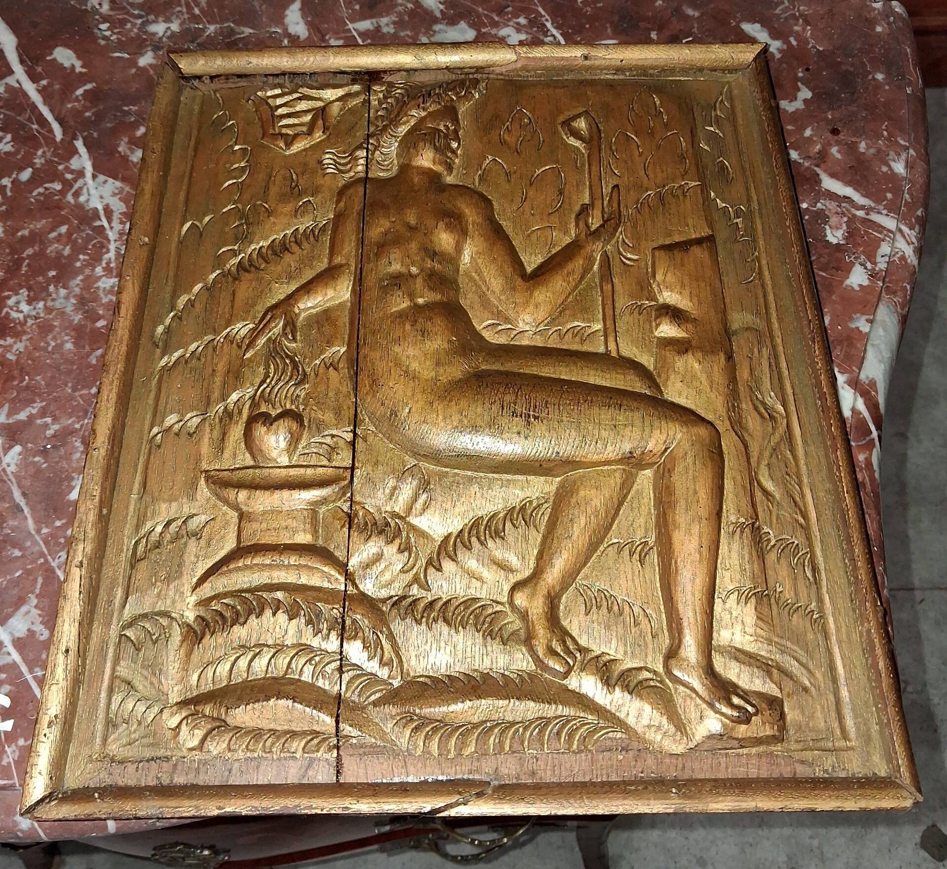 Carved oak panel depicting an allegorical female figure.