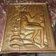 Carved oak panel depicting an allegorical female figure.