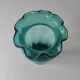 Blown glass vase with a flared neck and wavy rim.