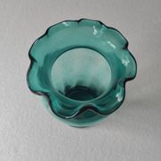 Blown glass vase with a flared neck and wavy rim.