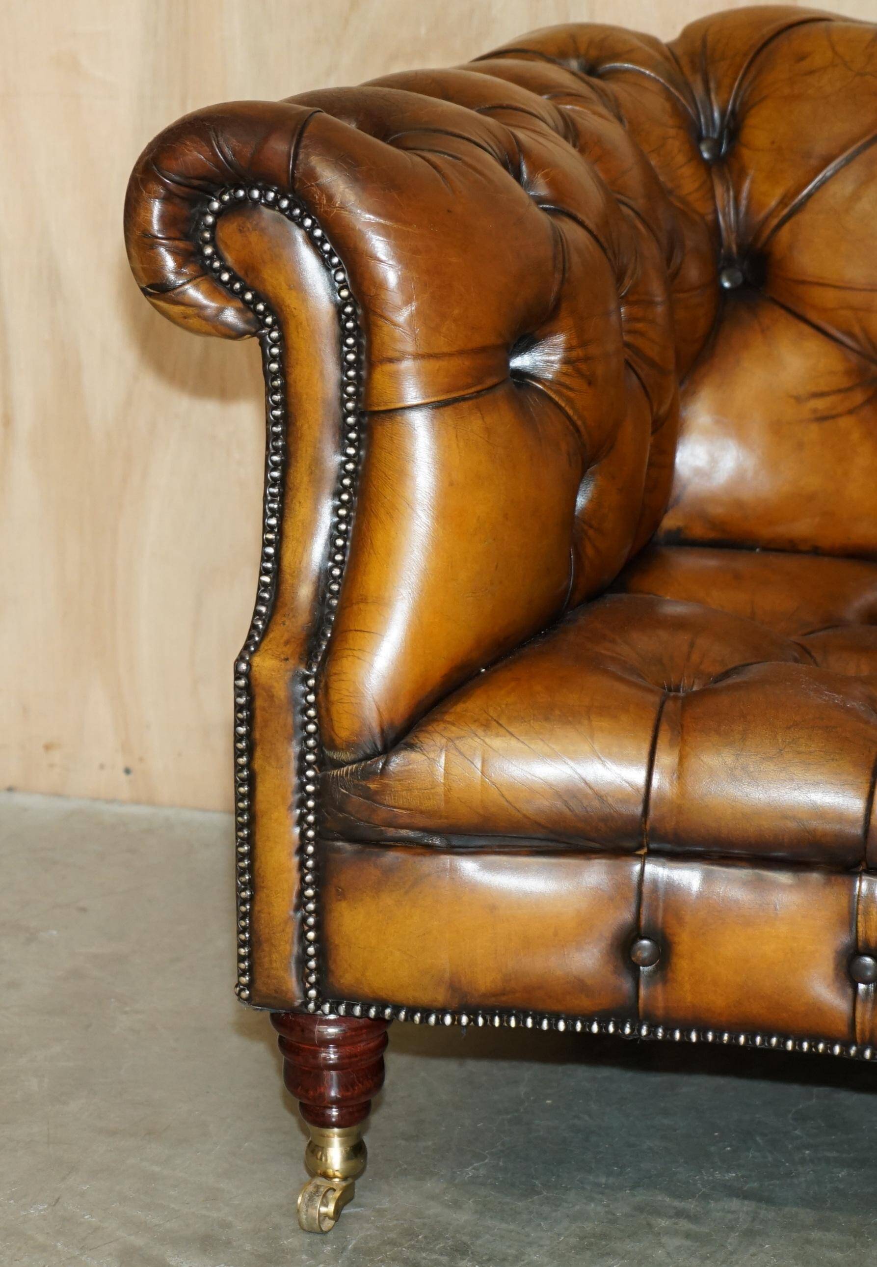 Vintage Chesterfield serpentine luxury sofa in restored leather