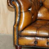 Vintage Chesterfield serpentine luxury sofa in restored leather