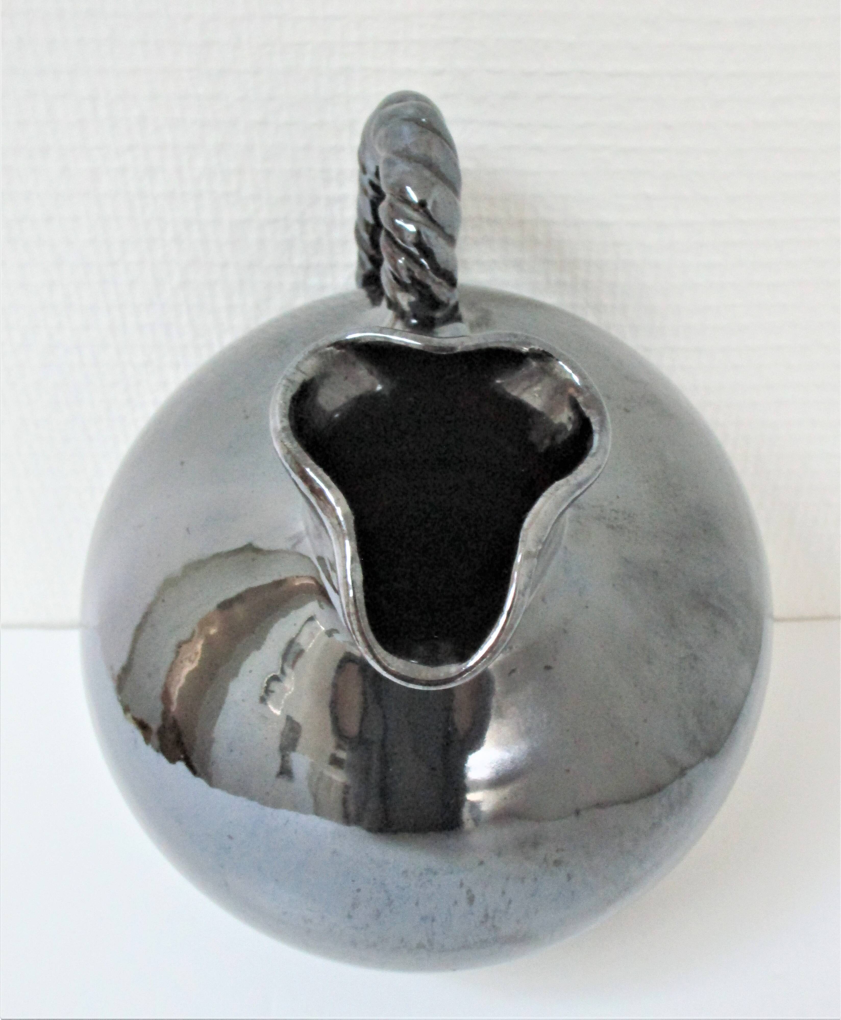 Black pearl glaze ceramic pitcher by Reinhold Rieckmann signed