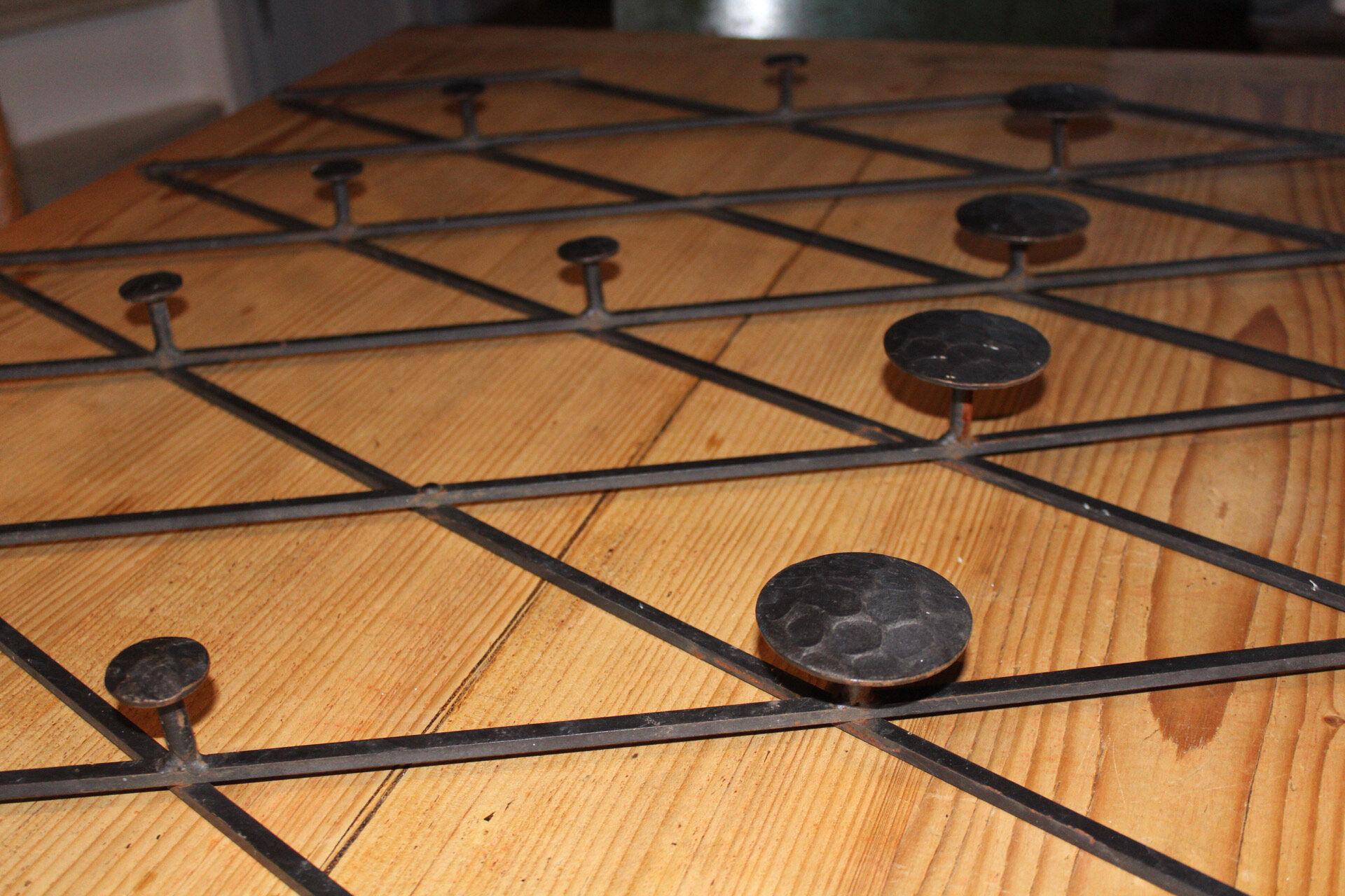 Patere wears vintage iron forge coat