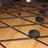 Patere wears vintage iron forge coat