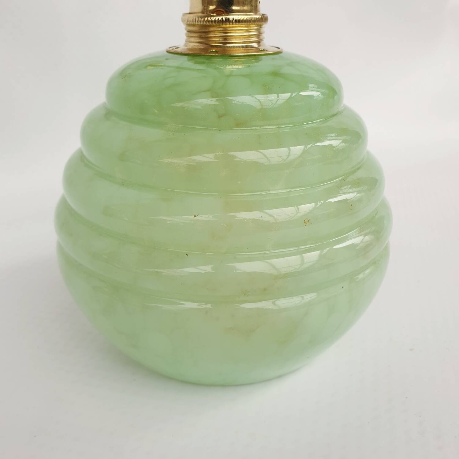 Brass collar and speckled glass wall lamp