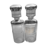 Pair of transparent glass pharmacy bottles