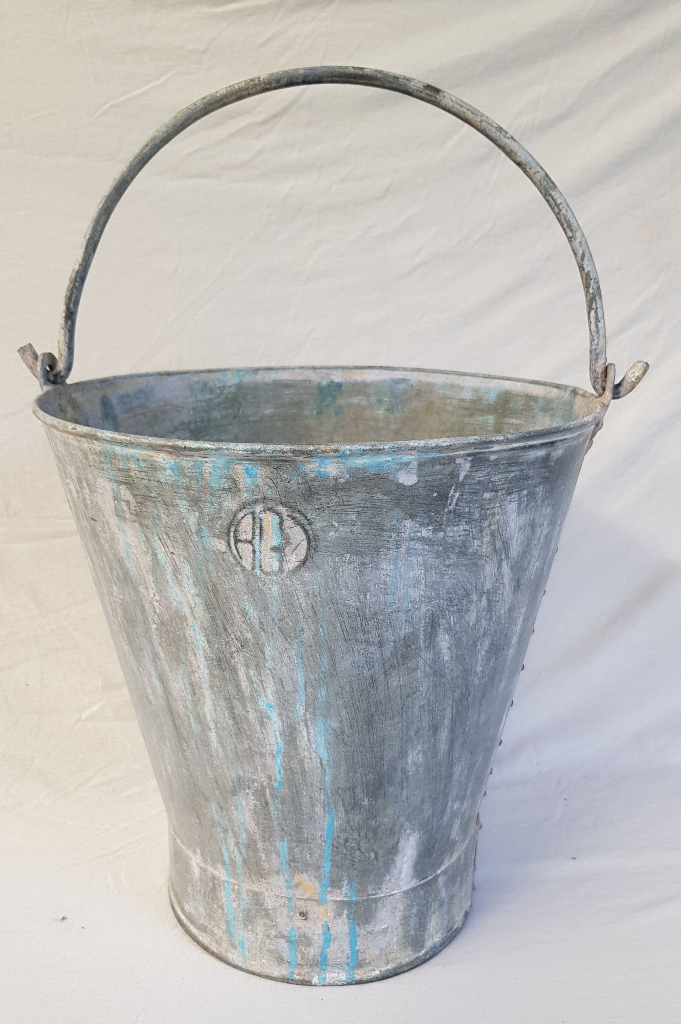 Old bucket with thick zinc handle