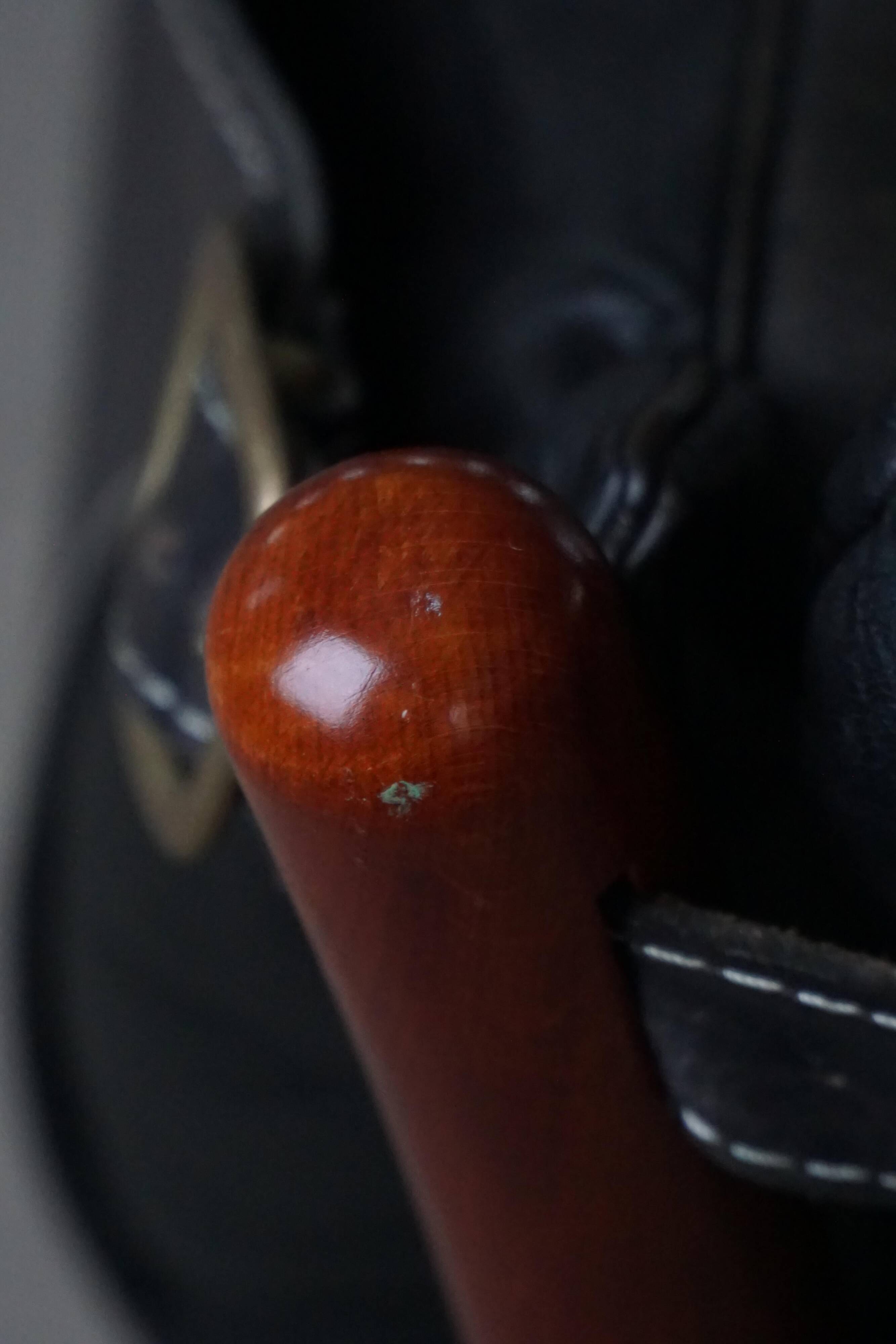 "Lounge chair 'Ilona' by Arne Norell in stained beech and leather, mid-20th century."