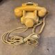 Old dial telephone from the 80s temat quimper bakelite yellow and beige