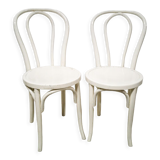 Pair of white Baumann bistro chairs