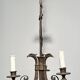 Empire-style bronze chandelier with 3 arms of light topped with eagle heads. French work. Circa 1900.