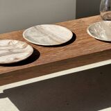 Tray, circular dish or plate made of white striped grey petrified wood.