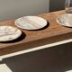 Tray, circular dish or plate made of white striped grey petrified wood.