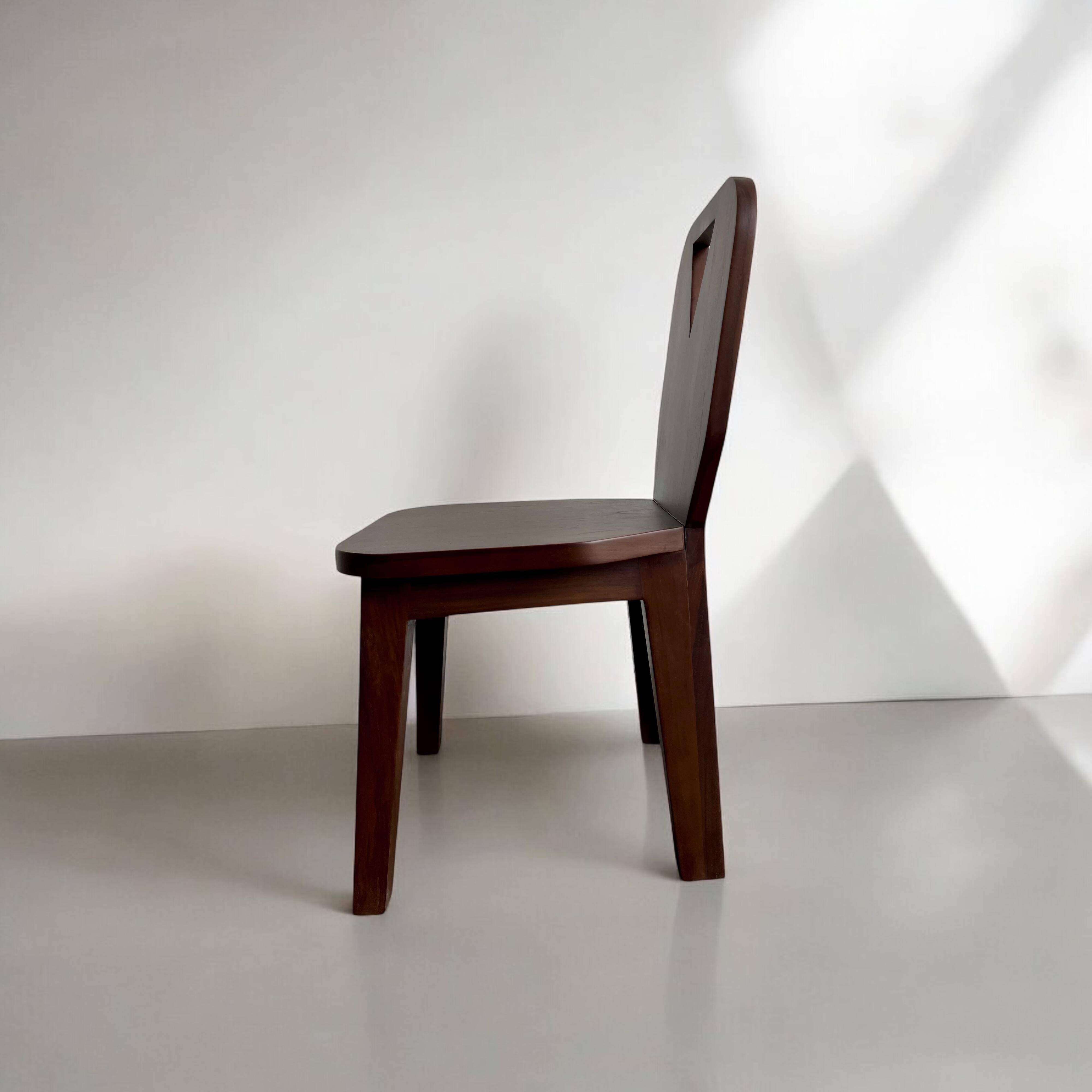 Retro brutalist chair in dark solid wood