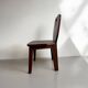 Retro brutalist chair in dark solid wood