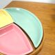 Pastel color bowls set in rattan basket vintage