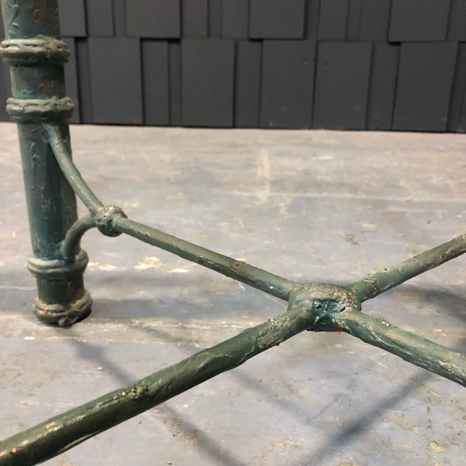 Iron and glass side table with antique patina